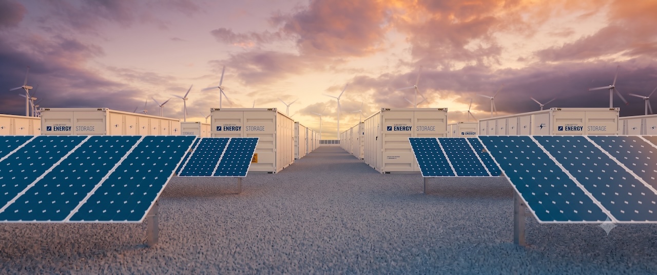 A modern utility-scale solar PV power plant integrated with containerized battery energy storage systems (BESS) under a clear sky